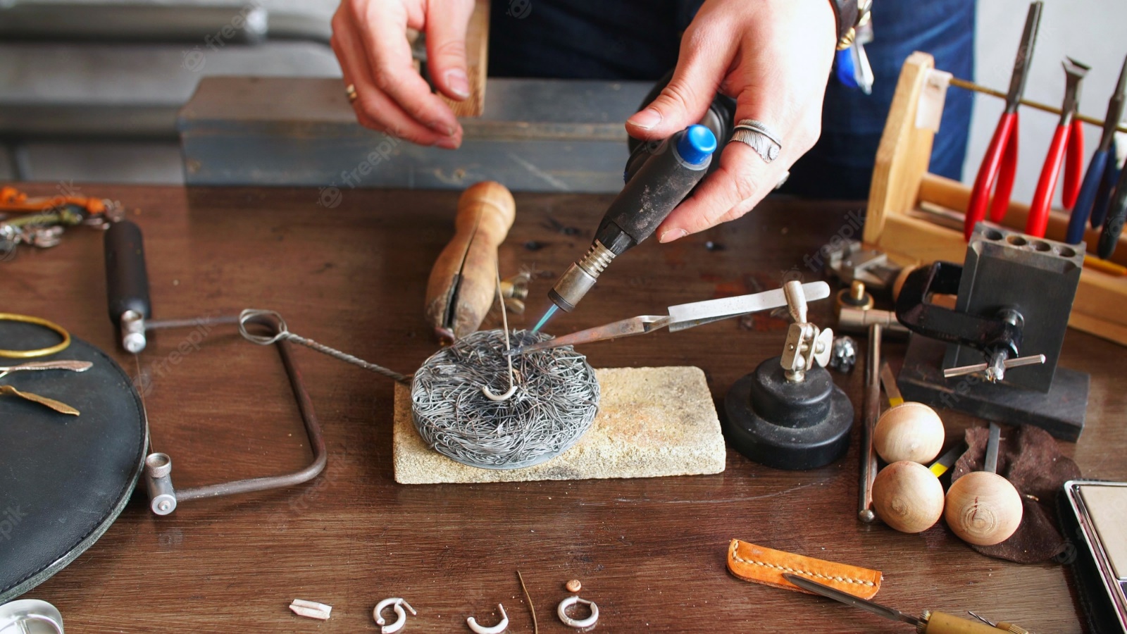 Premium Photo | Master jeweler works at his workplace in a jewelry  workshop. jewelry making, handmade.